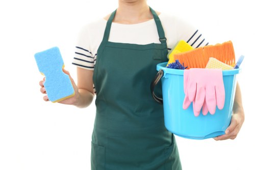 Professional cleaners performing end of tenancy cleaning in a kitchen